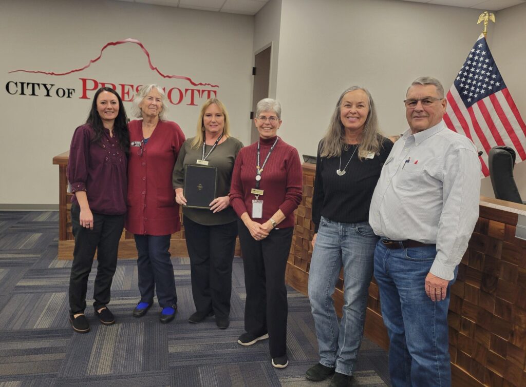 Image of Prescott Public Library Staff and Friends of Prescott Public Library board members accepting the Mayoral Proclamation for National Library Week. 