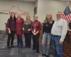 Image of Prescott Public Library Staff and Friends of Prescott Public Library board members accepting the Mayoral Proclamation for National Library Week.